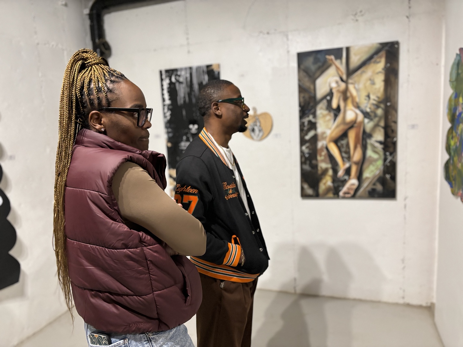 Visitors looking at artwork in the gallery